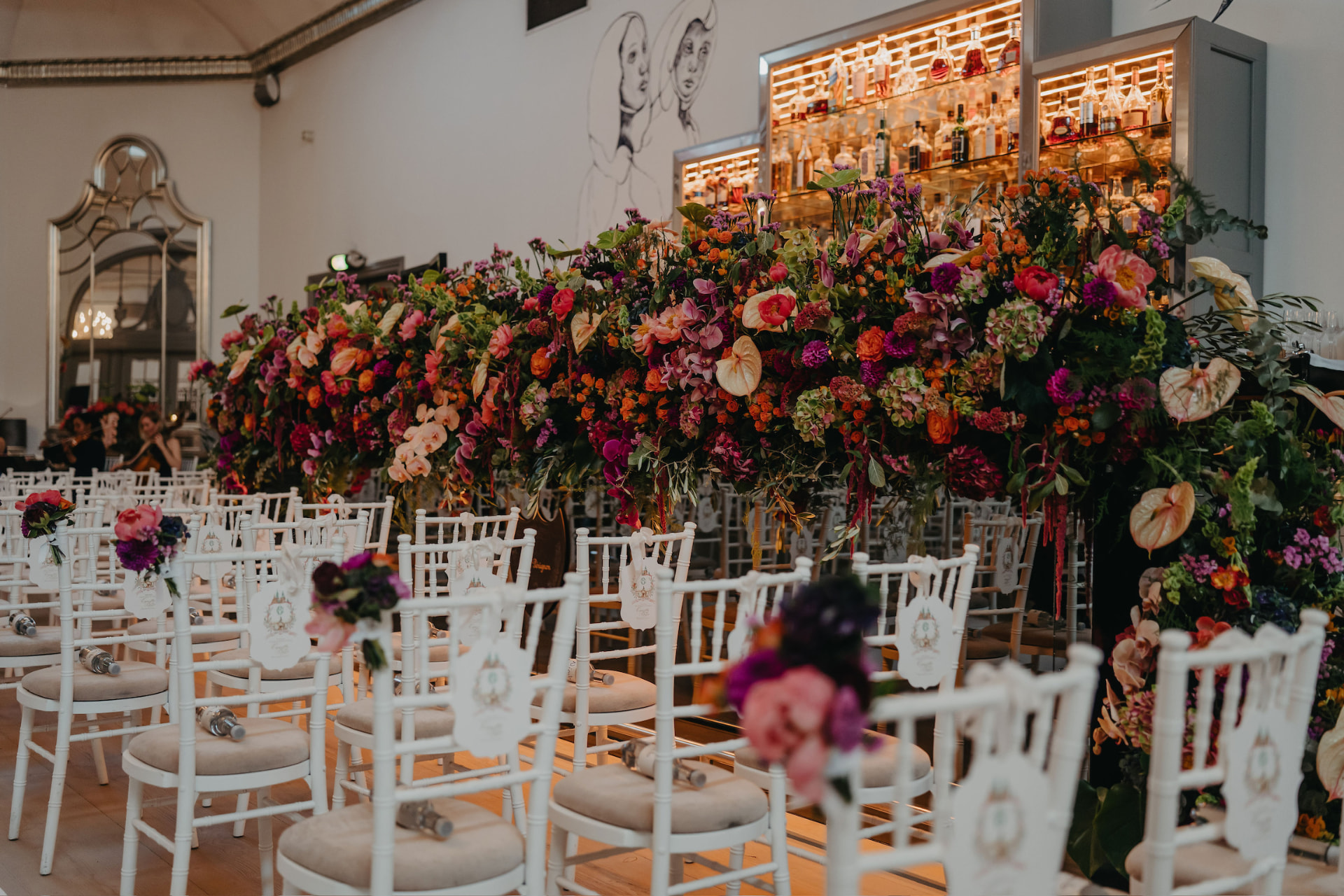 A luxury floral wedding ceremony arrangement in an elegant European setting
