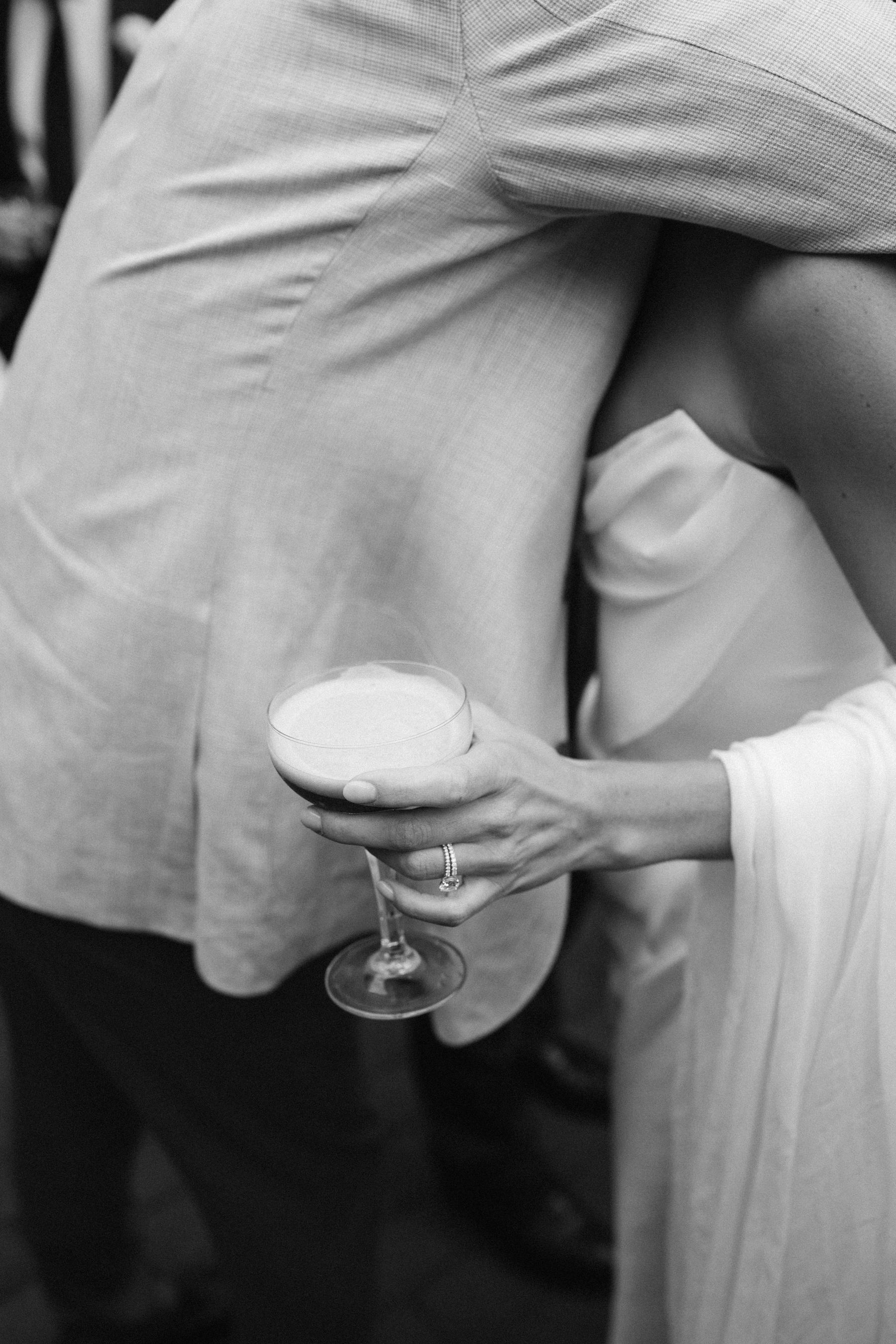 A glass, a ring, an embrace — the whole evening in one moment