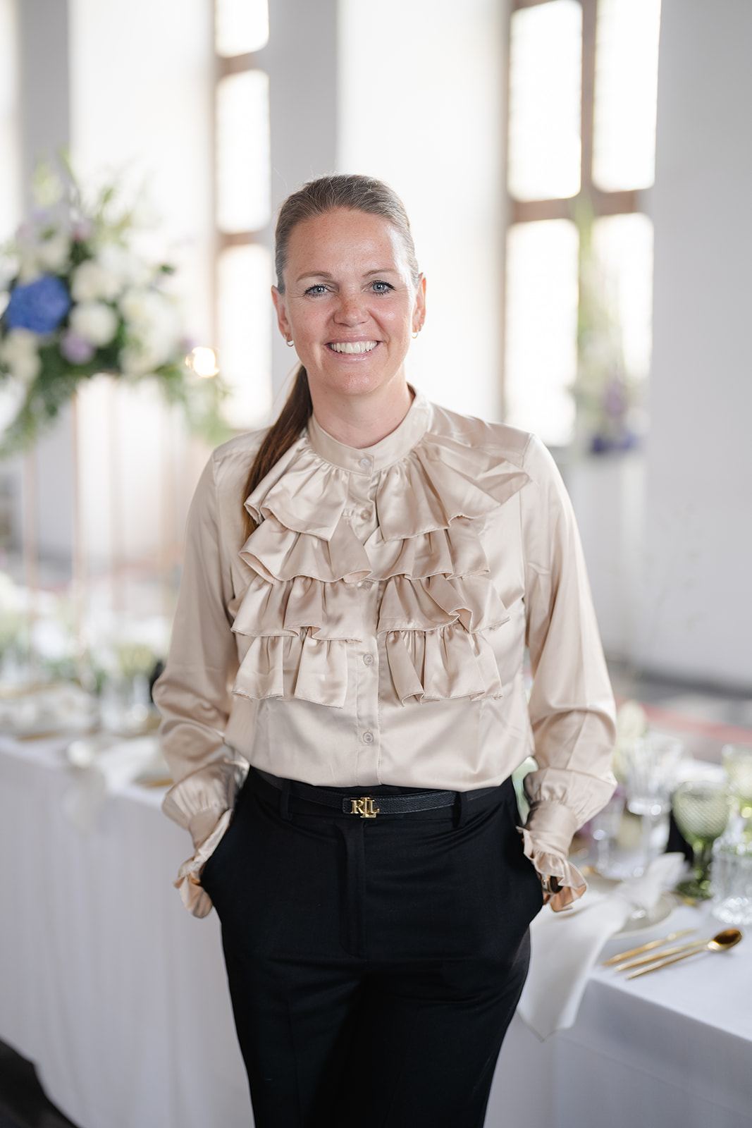 Christel Winther, founder and creative director, at work on a wedding setting