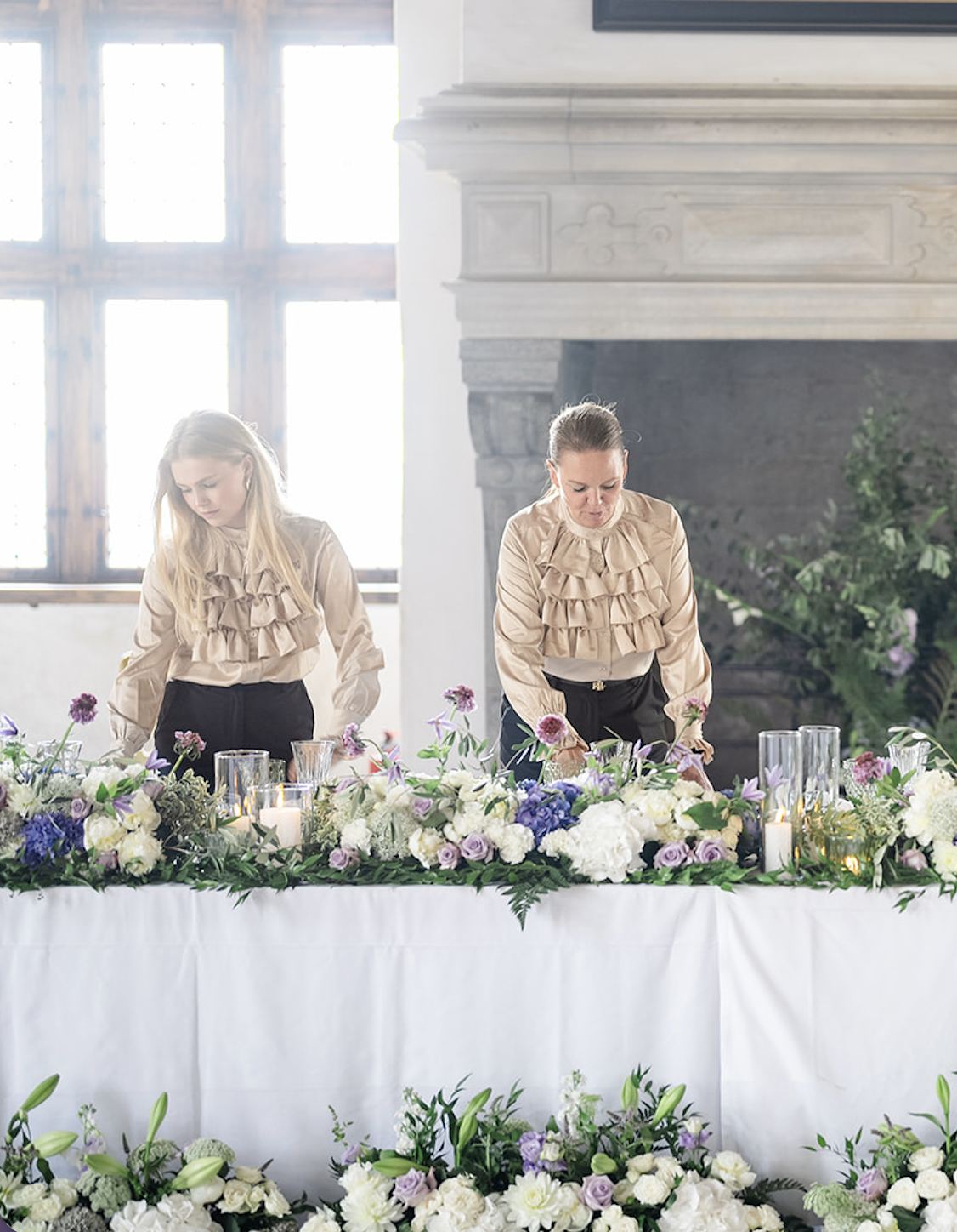 Christel Winther and team preparing floral arrangements at Kronborg Castle