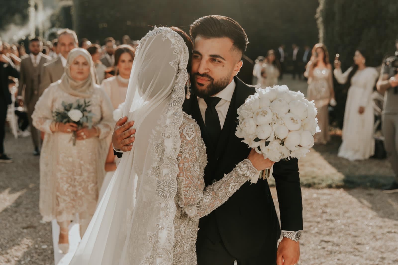 Couple walking after ceremony in Tuscany