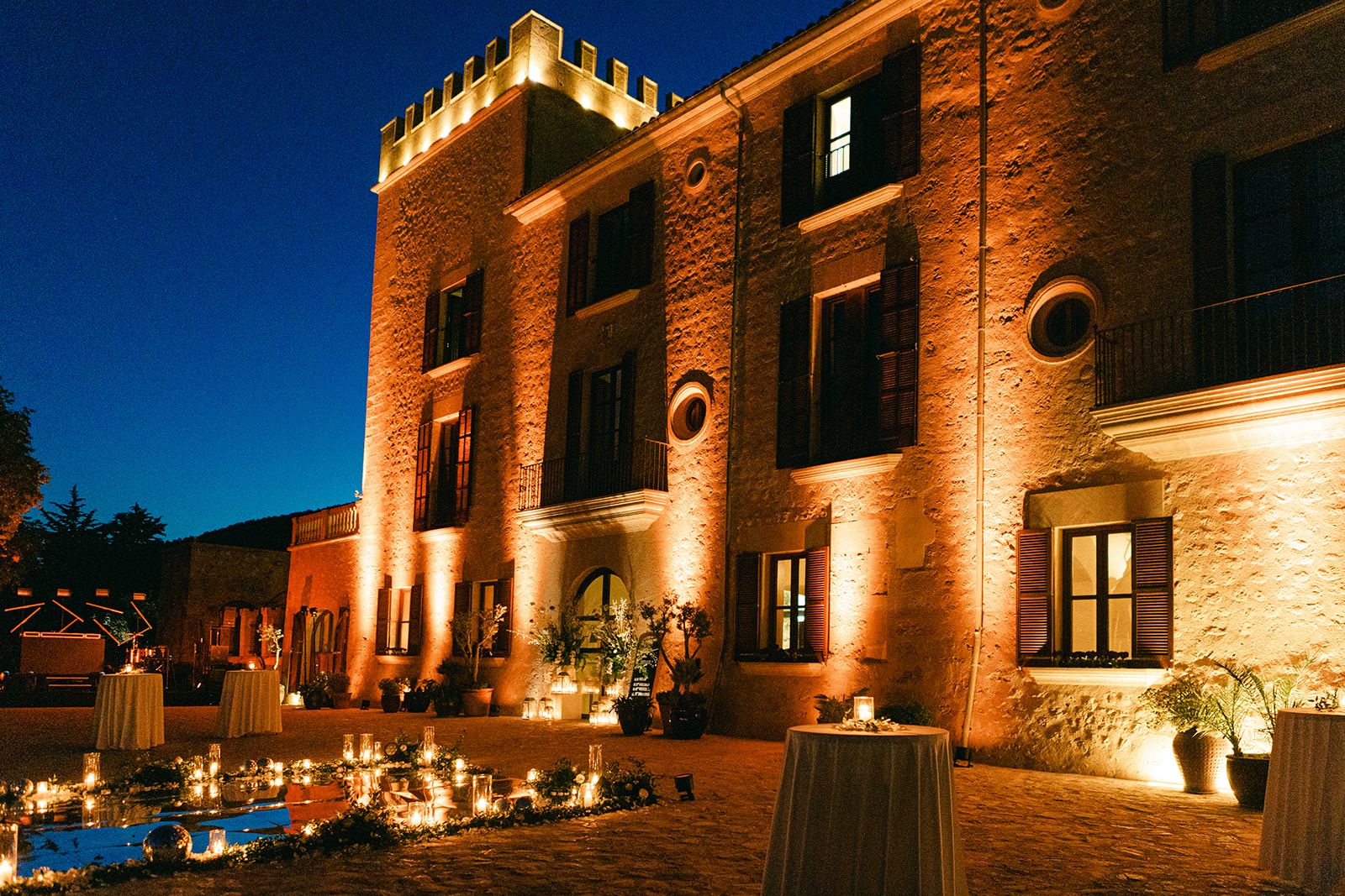 The estate at dusk — candlelight and history
